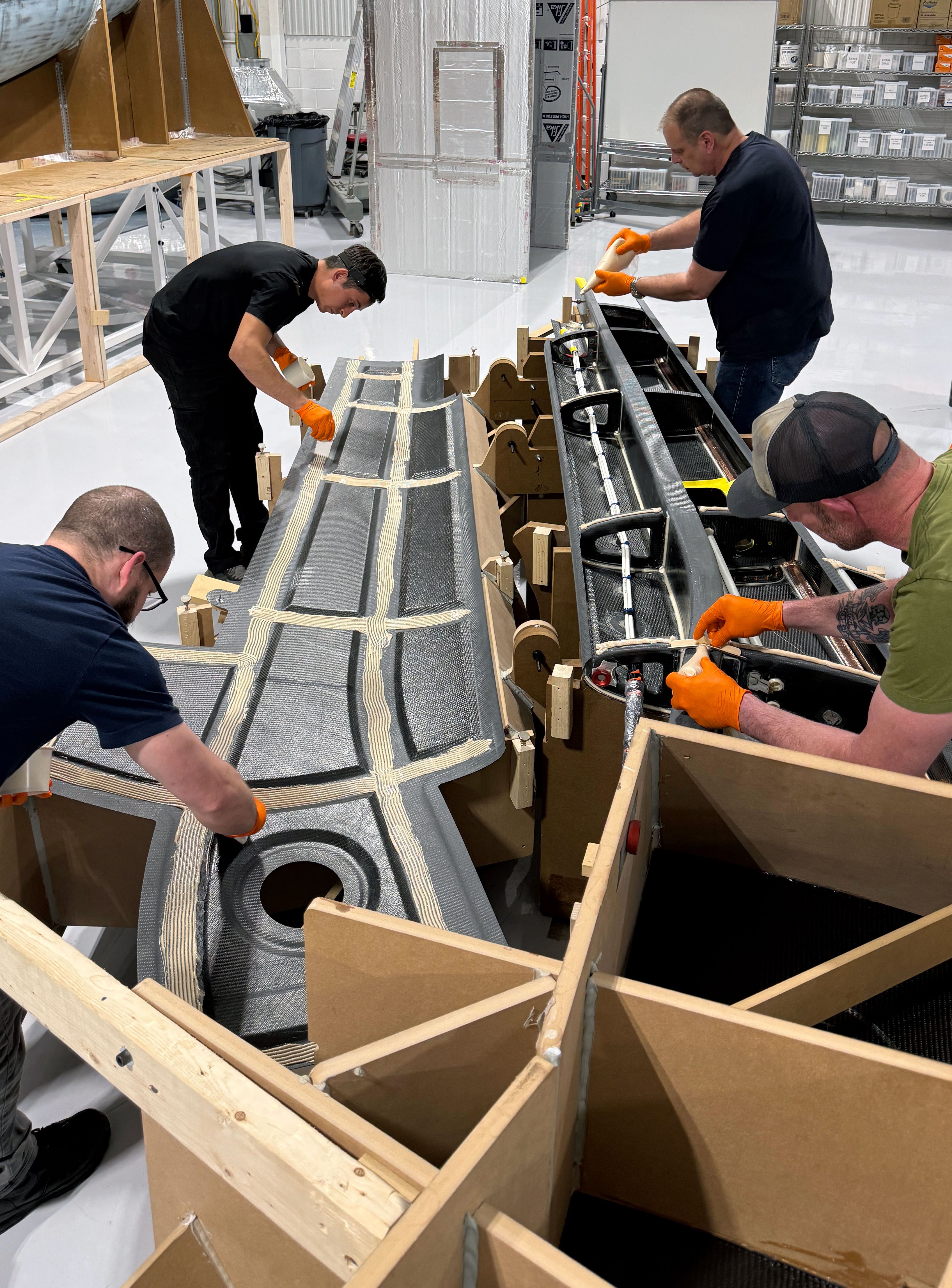 Technician handling aerospace component